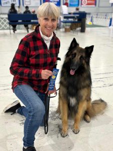 dog trainer, Wendi Daechsel, with her belgian shepherd, Kato